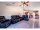 Spacious living room featuring comfortable leather seating and neutral walls at 101 Los Arbor Dr, Deland, FL 32724