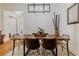 Elegant dining room with a live edge wood table and modern chairs at 1137 Avery Meadows Way, Deland, FL 32724