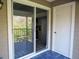 Sliding glass door leading to a screened balcony at 121 Reserve Cir # 209, Oviedo, FL 32765