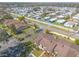 Drone captures townhome community amid street, trees and other neighborhoods at 1260 Charter Oaks Cir, Daytona Beach, FL 32117