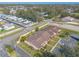 Wide aerial shot of townhome community with trees and other neighborhoods at 1260 Charter Oaks Cir, Daytona Beach, FL 32117