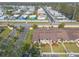 Aerial view of cozy townhomes with parking and small backyards in a neighborhood at 1260 Charter Oaks Cir, Daytona Beach, FL 32117