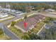 Aerial view of a townhouse with lovely landscaped grounds and parking spaces at 1260 Charter Oaks Cir, Daytona Beach, FL 32117
