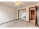 Bright bedroom with tile floors and mirrored closet doors at 1260 Charter Oaks Cir, Daytona Beach, FL 32117