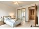 Cozy bedroom with a double bed, mirrored closet, and lots of natural light at 1260 Charter Oaks Cir, Daytona Beach, FL 32117