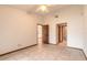 Spacious bedroom with tile floors and access to bathroom at 1260 Charter Oaks Cir, Daytona Beach, FL 32117