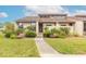 Front view of charming villa with well-manicured landscaping at 1260 Charter Oaks Cir, Daytona Beach, FL 32117