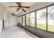 Bright Florida room with lots of natural light, ceiling fans, and access to the yard at 1260 Charter Oaks Cir, Daytona Beach, FL 32117