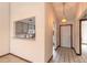 Hallway with kitchen pass-through and access to other rooms at 1260 Charter Oaks Cir, Daytona Beach, FL 32117