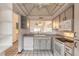 Kitchen with breakfast bar and view into the living room at 1260 Charter Oaks Cir, Daytona Beach, FL 32117