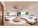 Relaxing living room with a white sectional sofa, rattan decor, and ocean views at 1260 Charter Oaks Cir, Daytona Beach, FL 32117