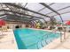Beautiful pool featuring a covered screen and lots of seating at 1260 Charter Oaks Cir, Daytona Beach, FL 32117