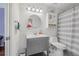 Simple bathroom with gray vanity and shower/tub combo at 129 Oyster Catcher Ct, Daytona Beach, FL 32119
