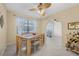 Dining room with wooden table and chairs, and access to living room at 129 Oyster Catcher Ct, Daytona Beach, FL 32119