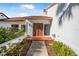 Inviting entryway with double doors and terracotta tile floor at 129 Oyster Catcher Ct, Daytona Beach, FL 32119