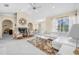 Spacious living room featuring white sectional sofa and a fireplace at 129 Oyster Catcher Ct, Daytona Beach, FL 32119