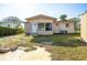 Ranch home with a spacious backyard, shed, and large sunroom at 1331 Granada Ave, Daytona Beach, FL 32117