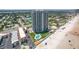 Aerial view of beachfront property with pool and tennis courts at 1420 N Atlantic Ave # 1102, Daytona Beach, FL 32118