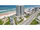 Aerial view of beachfront high-rise building with ocean and road views at 1420 N Atlantic Ave # 1102, Daytona Beach, FL 32118