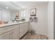 Bathroom boasts double vanity and granite countertops at 1420 N Atlantic Ave # 1102, Daytona Beach, FL 32118