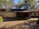 View of home's backyard and screened porch at 1525 S Hayden Rd, Deland, FL 32724