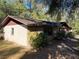 Side view of the home showcasing brick and stucco at 1525 S Hayden Rd, Deland, FL 32724