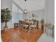 Elegant dining room with wood floors and a chandelier at 1575 Covered Bridge Dr, Deland, FL 32724