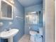 Updated bathroom with pedestal sink, toilet and shower/tub at 1612 Beatrice Dr, Orlando, FL 32810