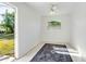 Cozy bedroom with wood-look flooring and access to backyard at 1612 Beatrice Dr, Orlando, FL 32810