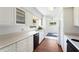 Efficient kitchen with white cabinets, and modern appliances at 1612 Beatrice Dr, Orlando, FL 32810