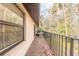 Balcony with metal railings and wooded views at 1668 Spring Garden Ct # 1668, Daytona Beach, FL 32117