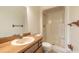 Bathroom with shower, toilet and wood vanity at 1668 Spring Garden Ct # 1668, Daytona Beach, FL 32117