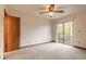 Bedroom with sliding glass doors to balcony at 1668 Spring Garden Ct # 1668, Daytona Beach, FL 32117