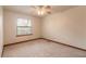 Bright bedroom with carpet flooring, window, and ceiling fan at 1668 Spring Garden Ct # 1668, Daytona Beach, FL 32117