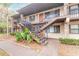 Two-story building exterior with stairs and landscaping at 1668 Spring Garden Ct # 1668, Daytona Beach, FL 32117