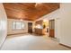 Spacious living area with kitchen access and wood ceilings at 1668 Spring Garden Ct # 1668, Daytona Beach, FL 32117