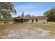 Backyard view featuring a patio and seating area at 1870 S Lehigh Dr, Deltona, FL 32738