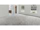 Bright bedroom with neutral carpet and two windows offering natural light at 1870 S Lehigh Dr, Deltona, FL 32738
