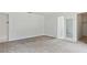 Spacious bedroom featuring neutral carpeting and a convenient closet at 1870 S Lehigh Dr, Deltona, FL 32738