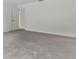 An empty bedroom with plush carpeting and neutral paint, ready for your personal touch at 1870 S Lehigh Dr, Deltona, FL 32738