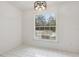 Bright dining room features a modern chandelier and a large window with views of the outdoors at 1870 S Lehigh Dr, Deltona, FL 32738