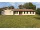 Charming single-story home with a manicured lawn and a welcoming double-door entryway at 1870 S Lehigh Dr, Deltona, FL 32738