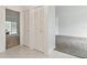 Hallway with closet and entrance to a living area, featuring tiled flooring at 1870 S Lehigh Dr, Deltona, FL 32738