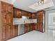 Updated kitchen featuring wood cabinets, stainless steel appliances, and bright tile floors at 1870 S Lehigh Dr, Deltona, FL 32738