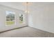Bright living room with two large windows and a decorative light fixture at 1870 S Lehigh Dr, Deltona, FL 32738