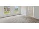 Spacious living room with new carpet and large windows allowing for lots of natural light at 1870 S Lehigh Dr, Deltona, FL 32738