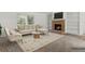 Cozy living room with a brick fireplace, built-in shelves, and a comfortable beige sectional sofa at 1870 S Lehigh Dr, Deltona, FL 32738
