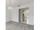 Bright living room showcasing white walls, neutral carpet, and decorative lighting at 1870 S Lehigh Dr, Deltona, FL 32738