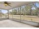 Enclosed patio providing an outdoor living space with a ceiling fan at 1870 S Lehigh Dr, Deltona, FL 32738