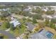 Beautiful aerial view of a home with a manicured lawn, mature trees, and a well-maintained neighborhood at 1930 Seclusion Dr, Port Orange, FL 32128